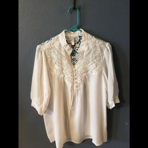 Cream colored shear blouse